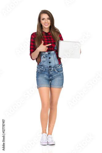 Smiling Woman Holding White Box And Pointing