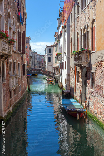 scenic canal with colorful ancient houses  Venice  Italy