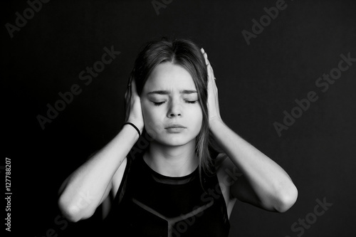 Wallpaper Mural Hear no evil. The girl closes the hands. Long hair Torontodigital.ca