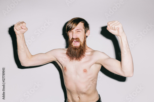 Portrait of a man on white studio background shouting