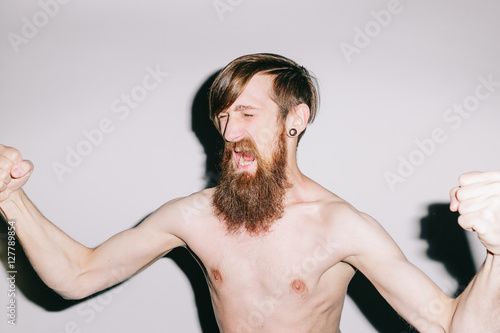 Studio portrait of a man screaming in anger