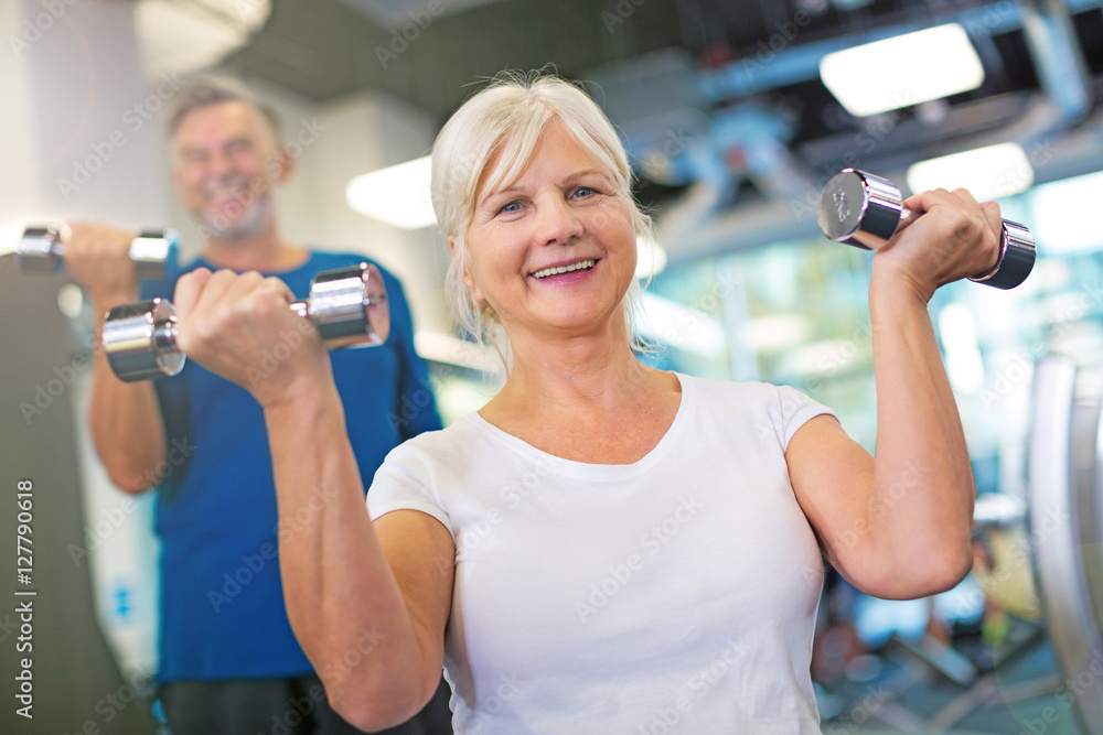 Senior couple exercising in gym
Senior couple exercising in gym