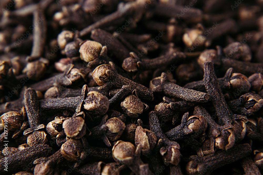 Clove spice closeup background. Fragrant asian spices. Top view. Clove spice closeup background. Fragrant asian spices. Top view.
