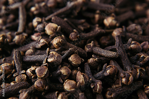 Clove spice closeup background. Fragrant asian spices. Top view.