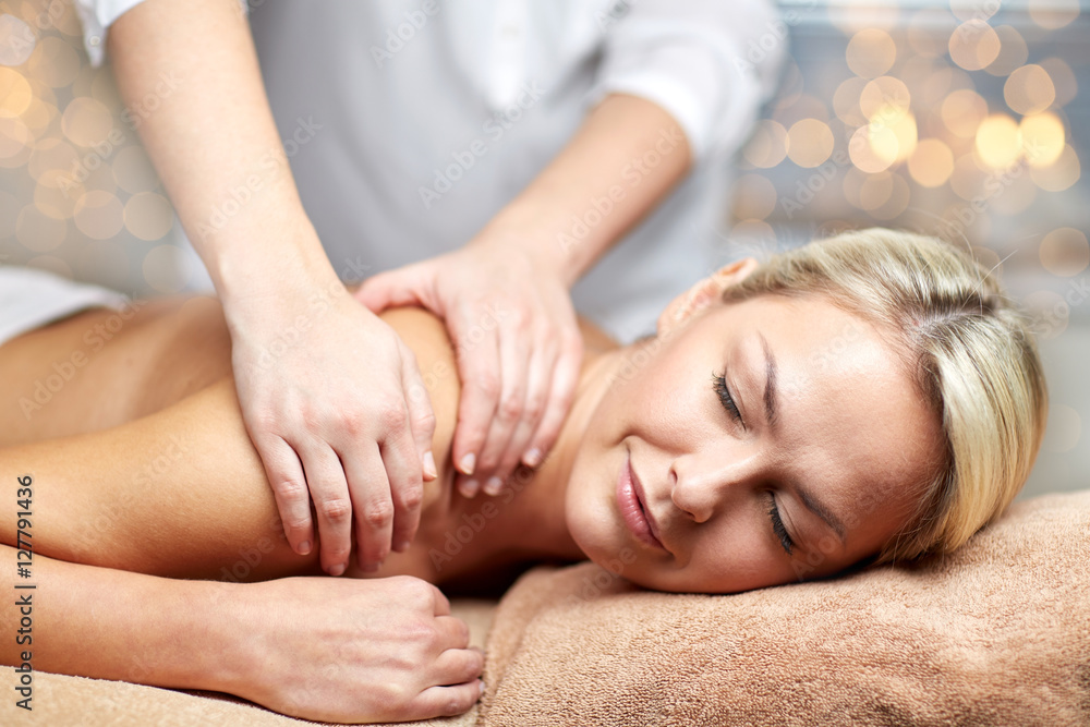 close up of woman lying and having massage in spa