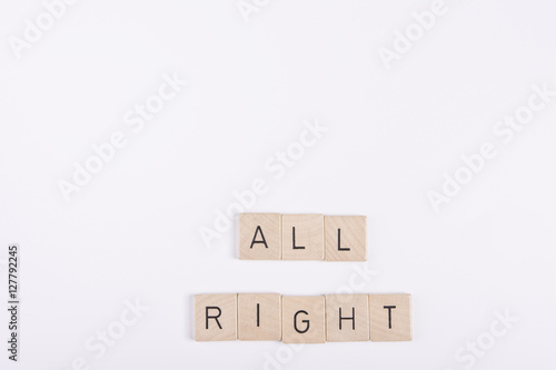 the word All right formed by letters written on wooden dowels