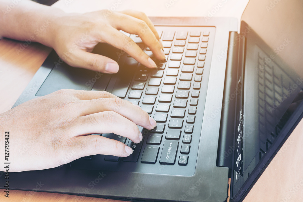 Businessman using laptop at office desk Businessman using laptop at office desk