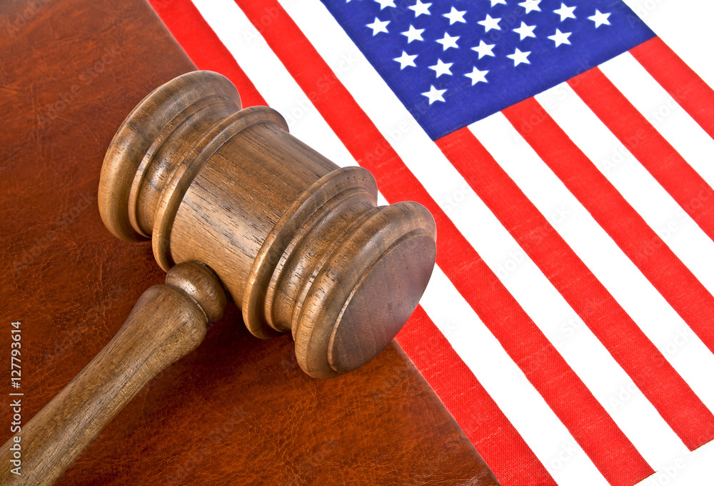 Judge wooden gavel and legal book with usa flag