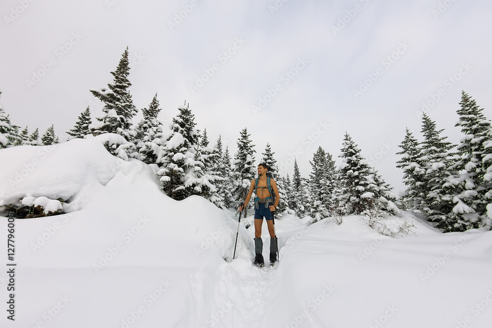 Male tourist with a backpack, with a naked torso and legs is amo Male tourist with a backpack, with a naked torso and legs is amo