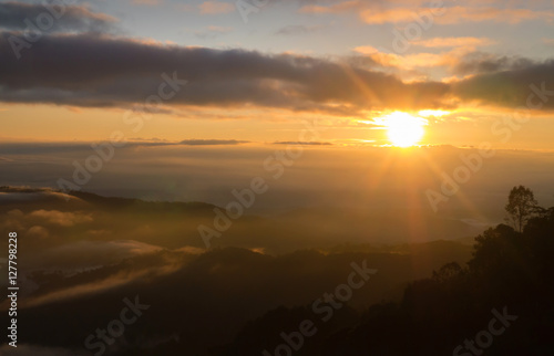 Landscape of sunrise and moving mist in the mountain and hill. View sunrise point of mountain at Doi-Montngo, Chiang Mai –Thailand