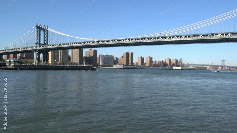 Manhattan Bridge over East River in New York at summer day. View from Brooklyn Manhattan Bridge over East River in New York at summer day. View from Brooklyn