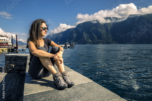 Beautiful woman is sitting on the sea-front, Norway © bint87