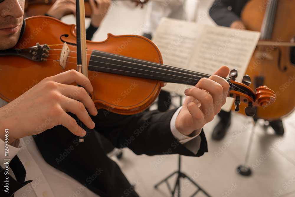 Violinist performing with orchestra Violinist performing with orchestra