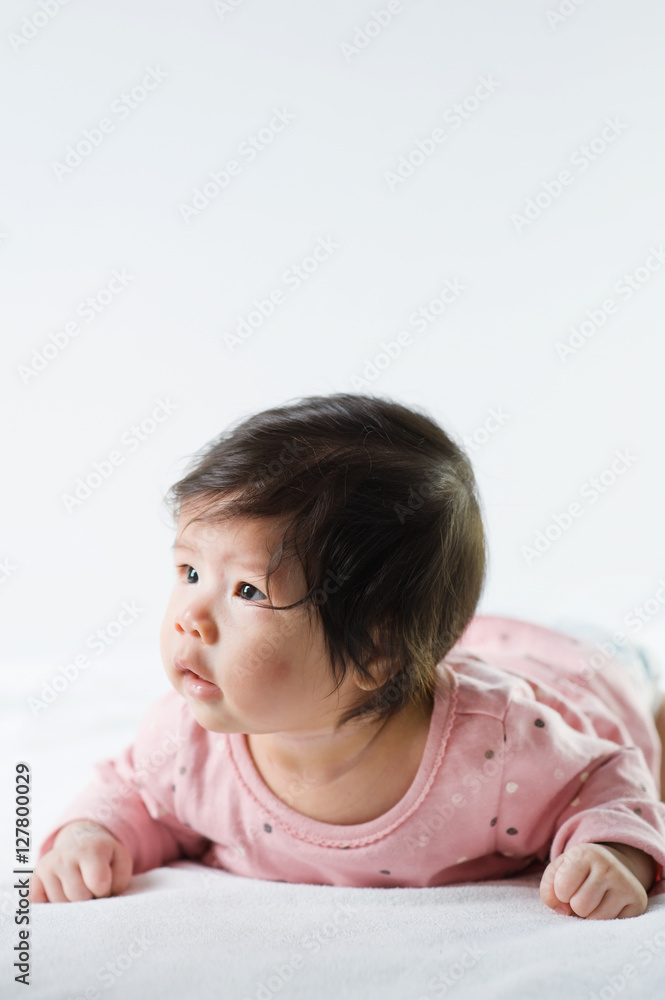 newborn baby girl in pink dress on white background newborn baby girl in pink dress on white background