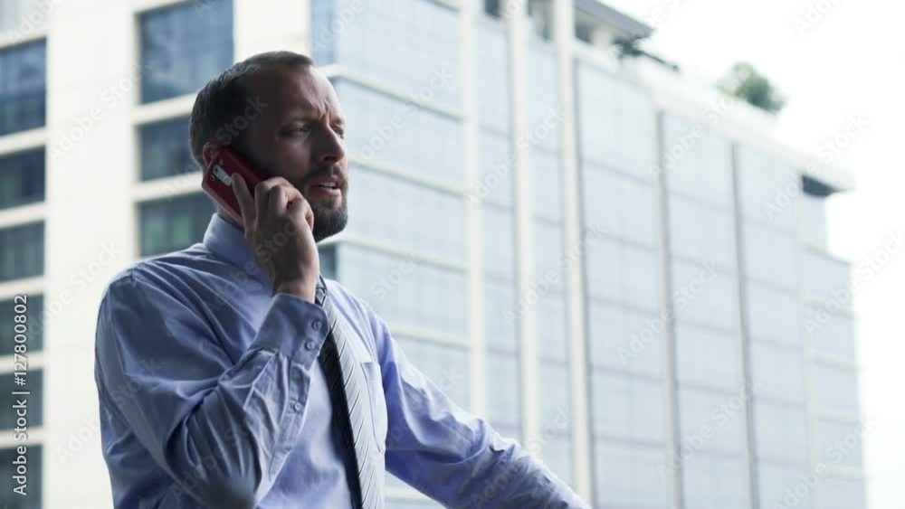 Young businessman talking on cellphone standing on terrace
Young businessman talking on cellphone standing on terrace