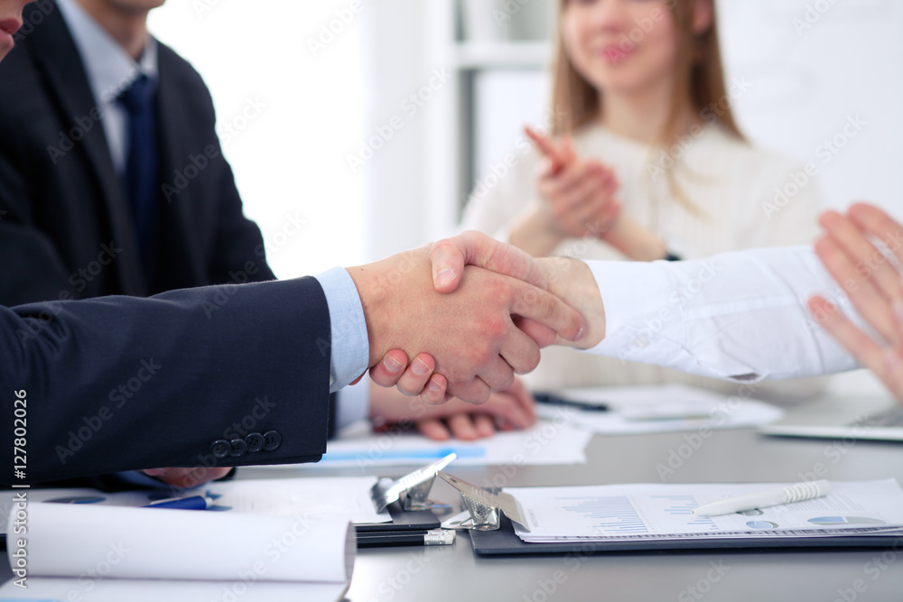 Close up of two business man shaking hands to each other finishing up the meeting Close up of two business man shaking hands to each other finishing up the meeting