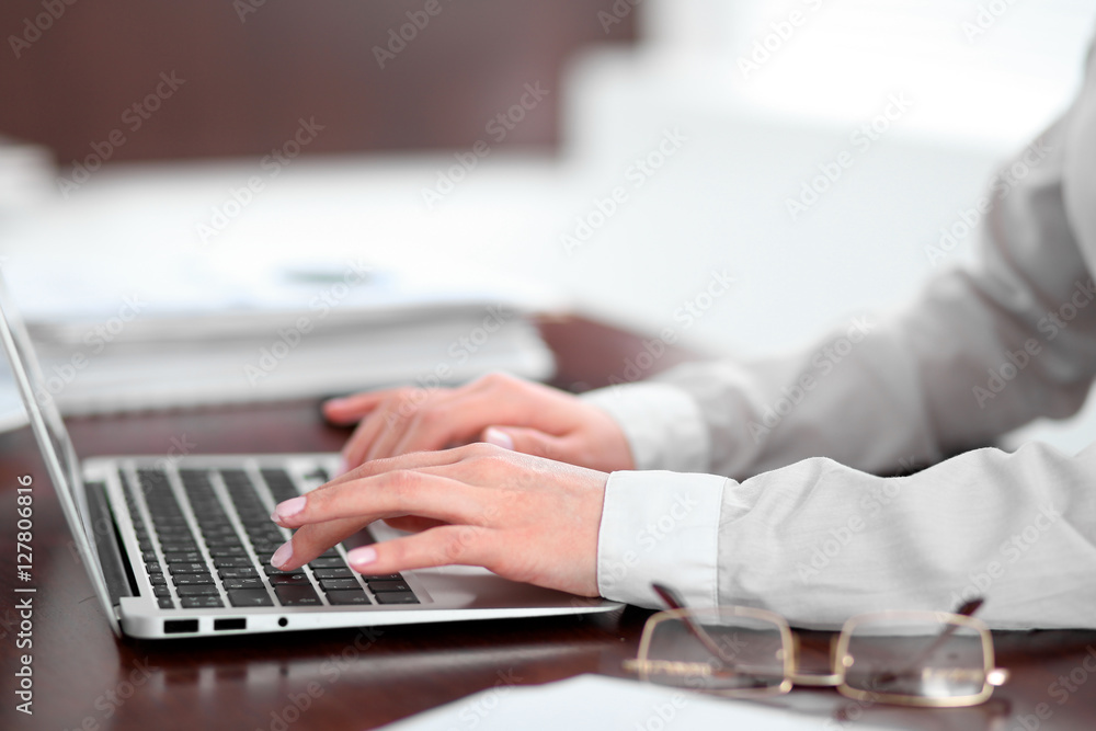 Close up of business woman hands typing on laptop computer Close up of business woman hands typing on laptop computer