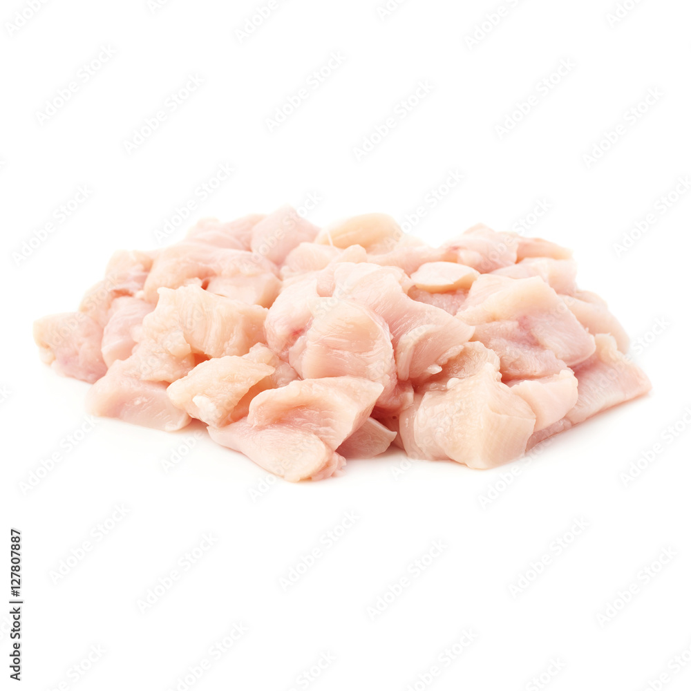 Raw chicken fillet cutted into pieces isolated over white background