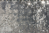 Silver background mosaic with light spots and stars