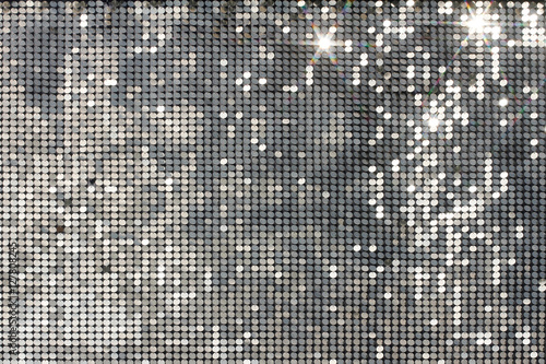 Mozaika na srebrnym tle z jasnymi plamami i gwiazdami