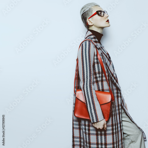 Stylish Lady fashion vintage glasses and checkered coat Trend wo photo