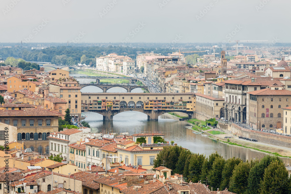 Cloudy view to the river Arno, with Ponte Vecchio, Palazzo Vecchio and Cathedral of Santa Maria del Fiore (Duomo), Florence, Italy