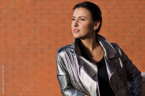 Stylish woman in leather jacket