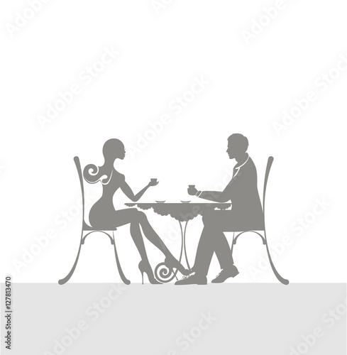 the icon of cute couple of man and woman sitting in a cafe. The icon of pleasant meeting and love atmosphere.