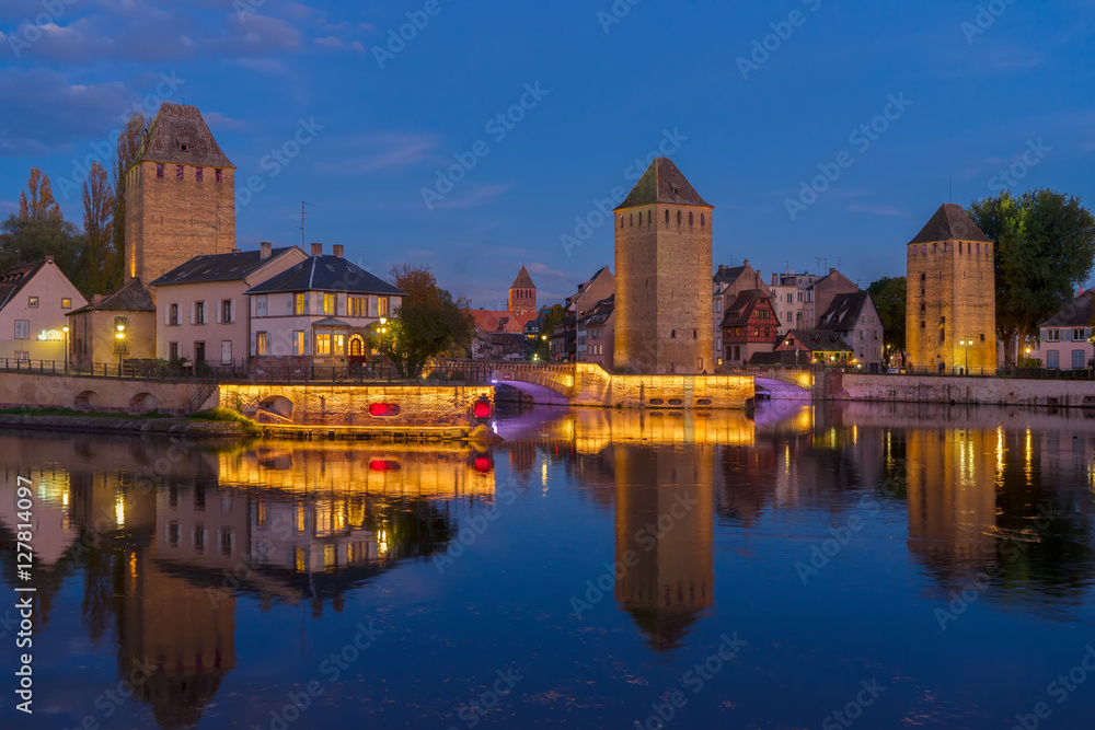 medieval bridge Ponts Couverts of Strasbourg at night, France