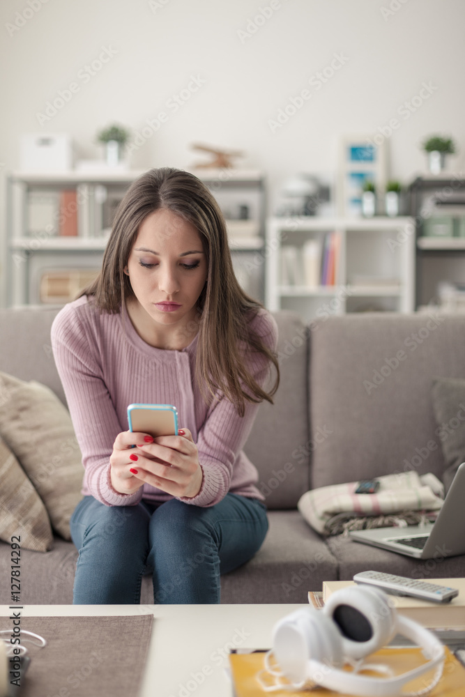 Girl using a smartphone Girl using a smartphone