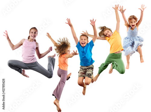 group of happy barefeet cheerful sportive children jumping and dancing