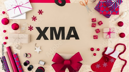 Video with lady doing xmas paper decoration
