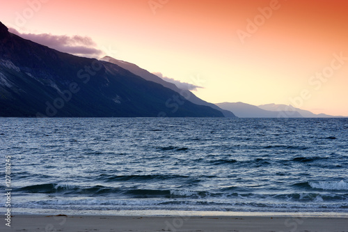 Mountain sunset at Norway sea background