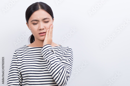 Woman has tooth ache isolated on white background © chajamp