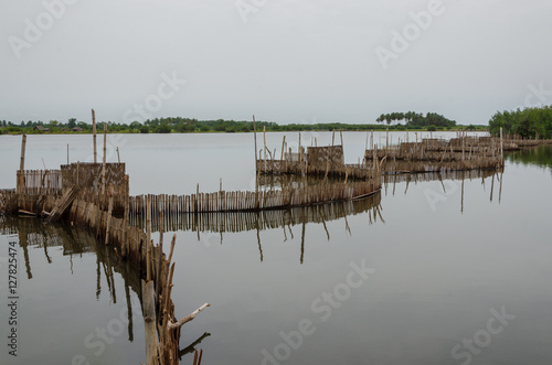 Traditional reed fishing traps used in wetlands near the coast in Benin.