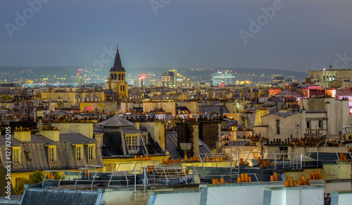 Photography Aerial view of Paris, France at night.