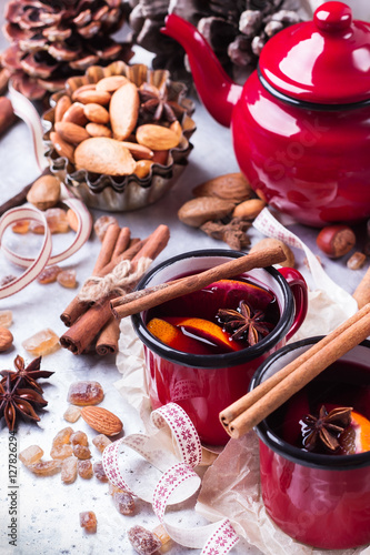 Hot mulled wine in a red mug for winter holidays