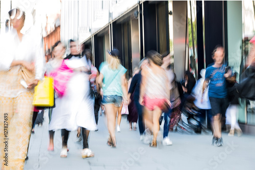 Blurred image of walking people. Londoners and tourists walking in Oxford street, one of the main shopping destination of London