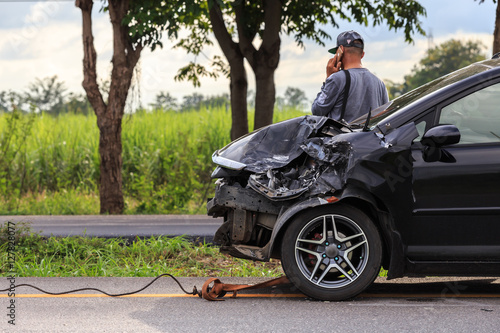 Black car get damaged by accident on the road