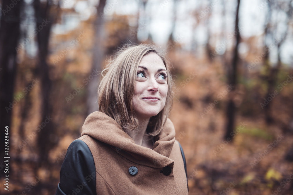 woman walking through the countryside in autumn time woman walking through the countryside in autumn time