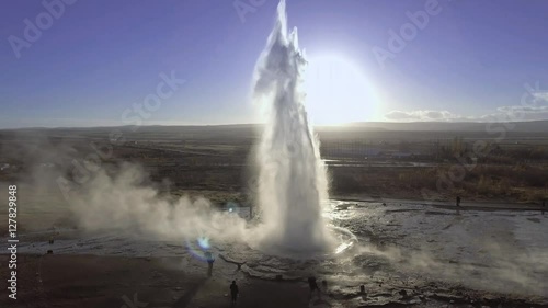Low level aerial view of Strokkur geyser erupting