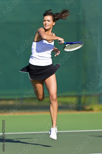 Tableau sur toile Tennis Player in mid air volley