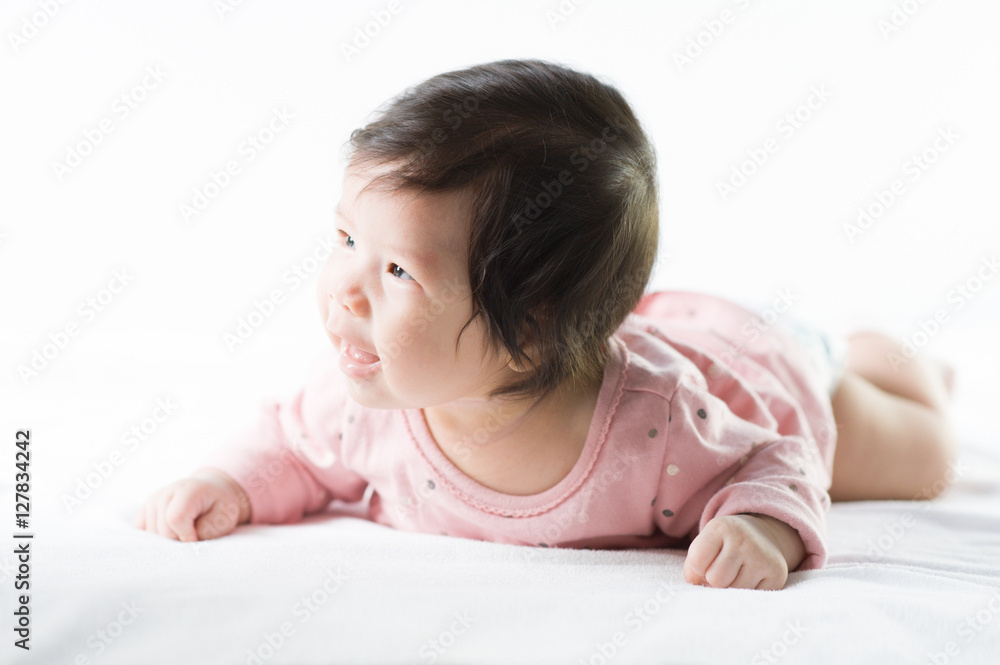 newborn baby girl in pink dress on white background newborn baby girl in pink dress on white background