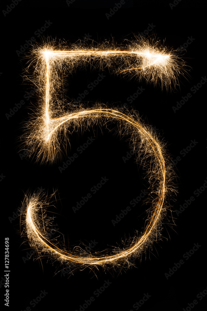 New year font sparkler number five on black background New year font sparkler number five on black background