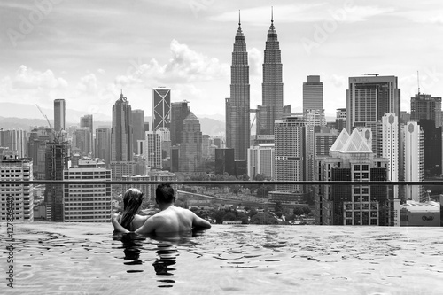 Marriage observing the city of Kuala Lumpur, from infinity pool