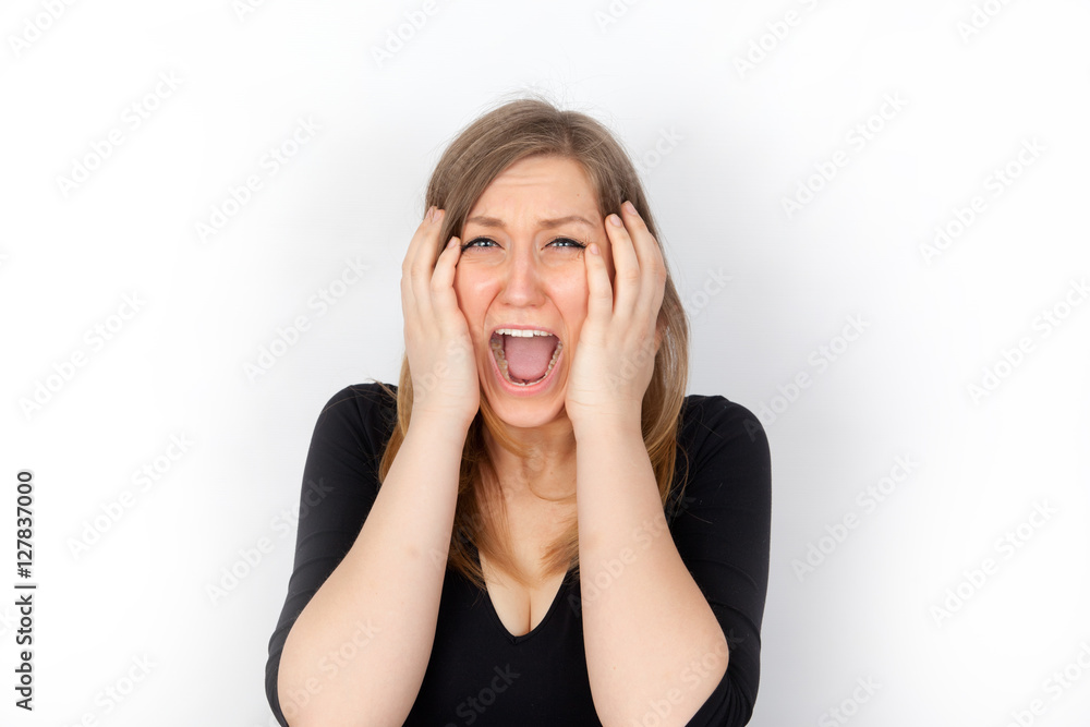 Young woman screaming in horror Young woman screaming in horror