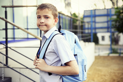 Cute schoolboy on street
