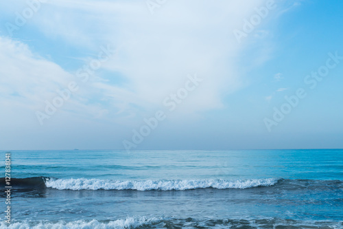 Blue sky with clouds over sea