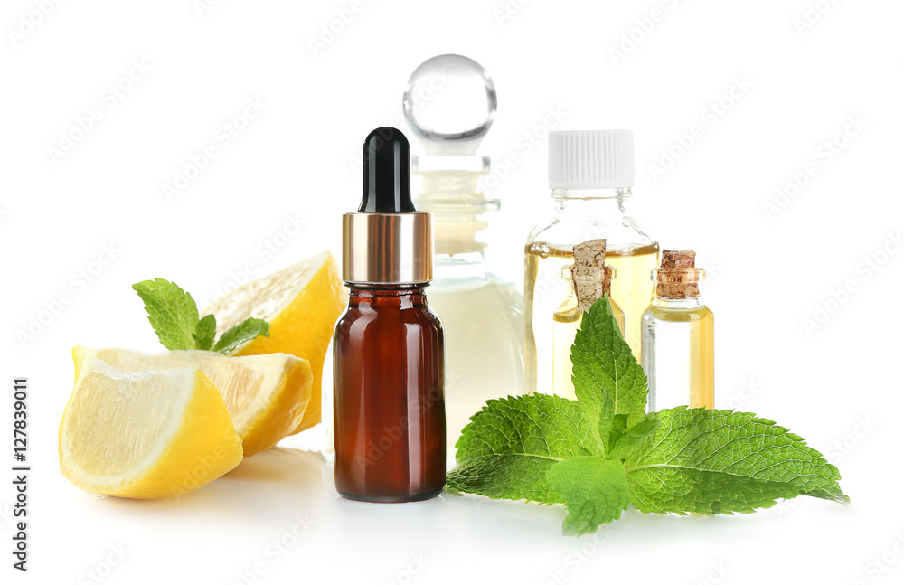 Beautiful spa composition with lemon essential oil on white background, closeup Beautiful spa composition with lemon essential oil on white background, closeup