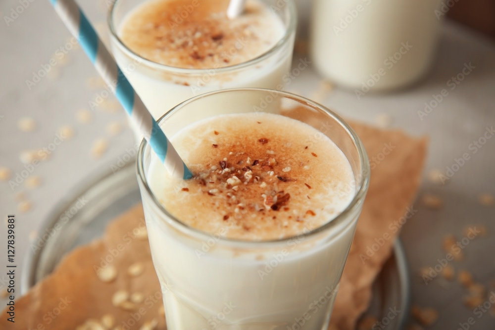 Delicious milkshake with chocolate in glass on table, closeup Delicious milkshake with chocolate in glass on table, closeup